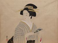 扇を持つ女